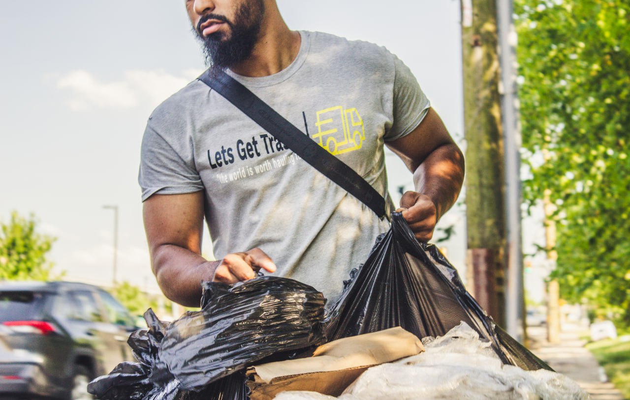 man holding a garbage cellophane